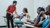 Students Mulu G/Semayat (in red, standing) and Nigist Belete (in white, sitting) take part in a practical session where they learn to test vital signs